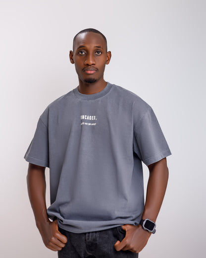 "WHY SO CAGED?" WASHED CHARCOAL TEE